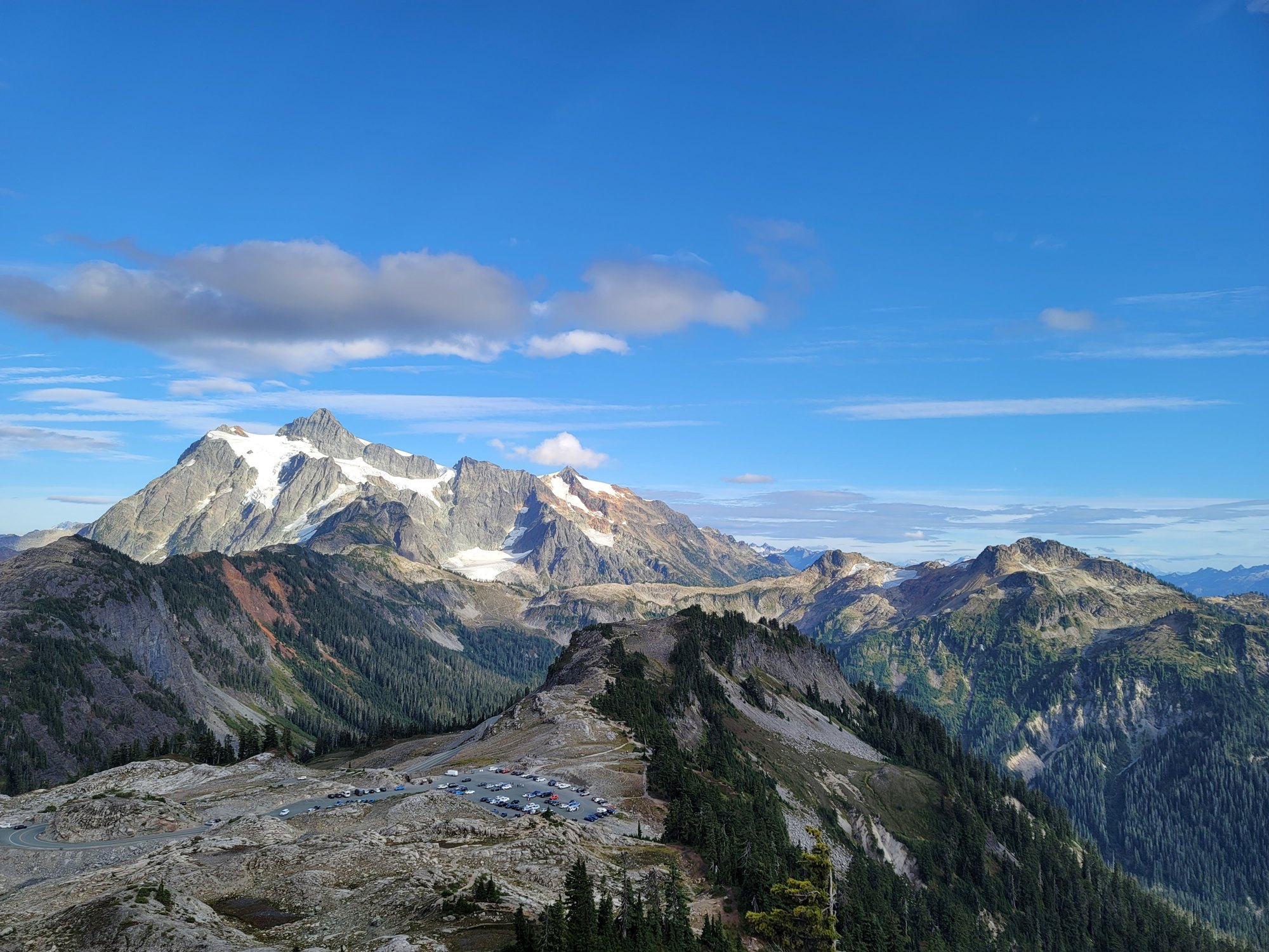 Mount Shuksan rising above the Artist Point parking area on a clear day