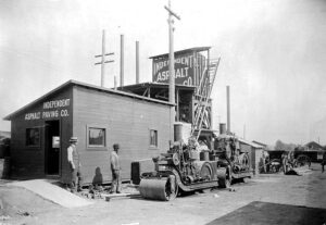 Around 1906 photo of steam rollers paving a street in Bellingham