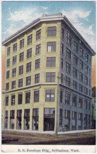1908 postcard of the wedge-shaped B.B. Furniture flatiron building in Bellingham