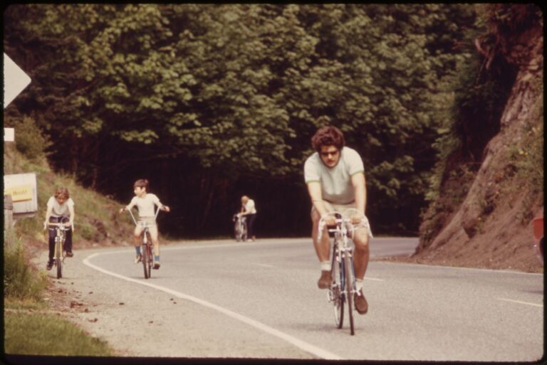 1973 color photograph of cyclists on Chuckanut Drive in Larrabee State Park near Bellingham