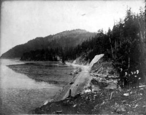 Circa 1902 photo of men standing on the early roadbed of Chuckanut Drive