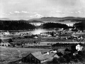 1906 elevated photograph of Friday Harbor on San Juan Island with Mount Baker on the horizon