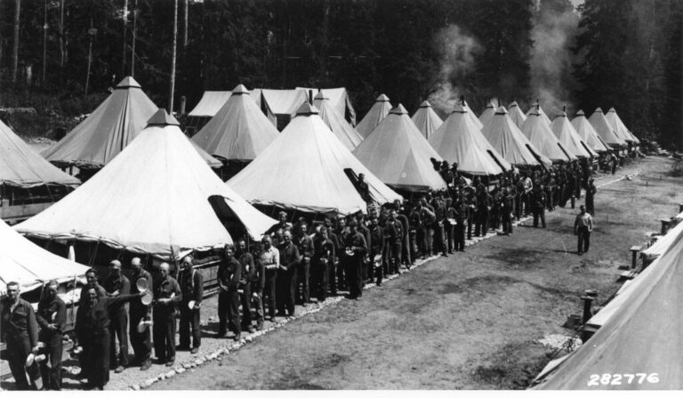 1930s photograph of Civilian Conservation Corps workers gathering for a meal at the Glacier camp in the Mount Baker forest