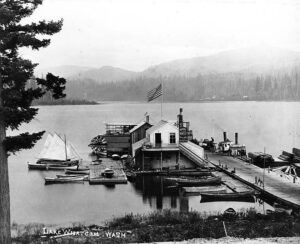 Circa 1892 photograph of rowboats and a sternwheeler at a boat landing on Lake Whatcom