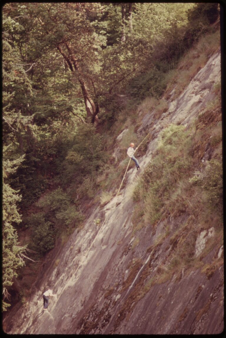 1973 color photograph of rock climbers practicing on a sandstone wall at Larrabee State Park near Bellingham