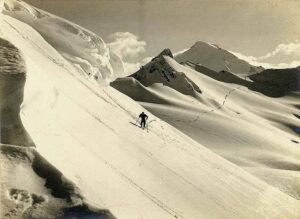 1930s photograph of a single skier crossing the snowfields near Coleman Creek on Mount Baker