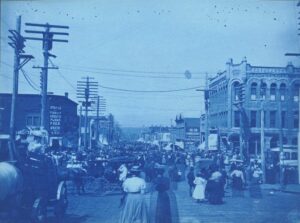 1900 photo of the Ringling Brothers circus parade moving through downtown Bellingham