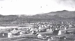1907 postcard showing the small border town of Sumas, Washington beneath the foothills