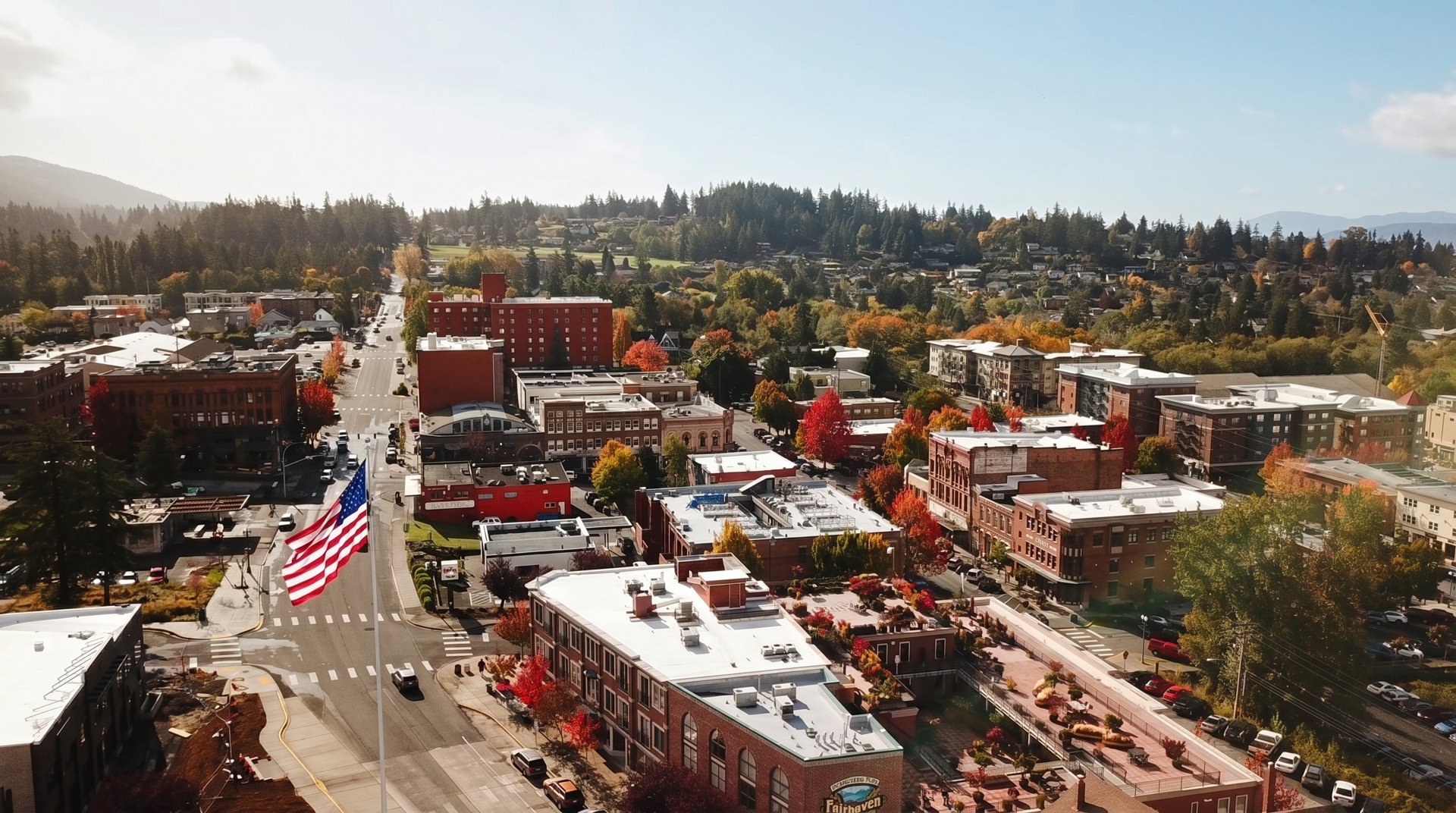 The flag over Twelfth Street in Fairhaven, autumn maples in full color